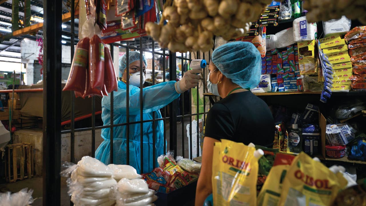 El Salvador Coronavirus negocios Pandemia Covid 19 medidas sanitarias temperatura termómetro
